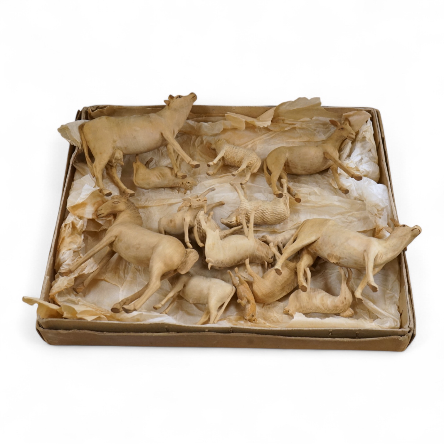 A collection of carved wood farm animals, largest 15.5cm